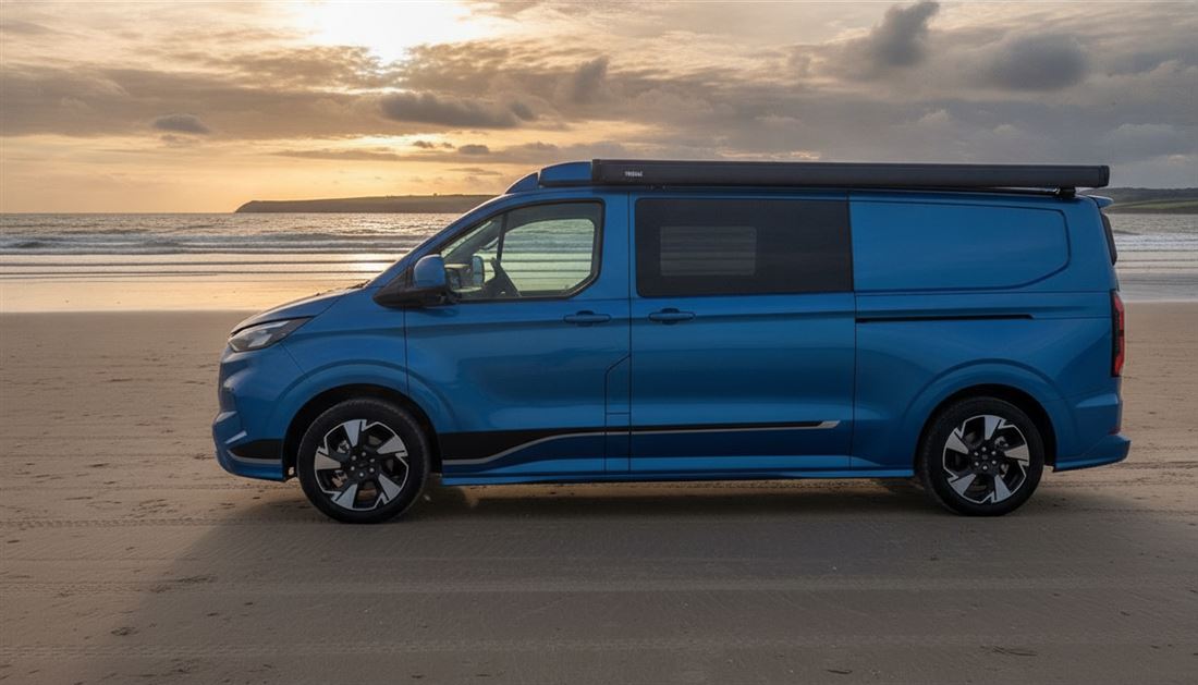 The camper on the sand at golden hour