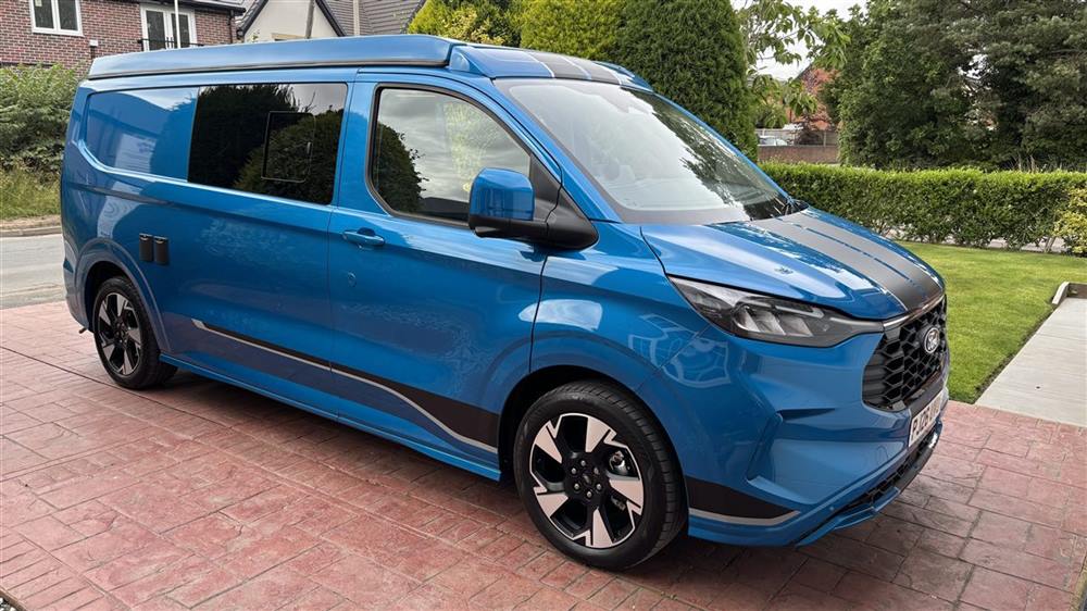 The van on the driveway, front view