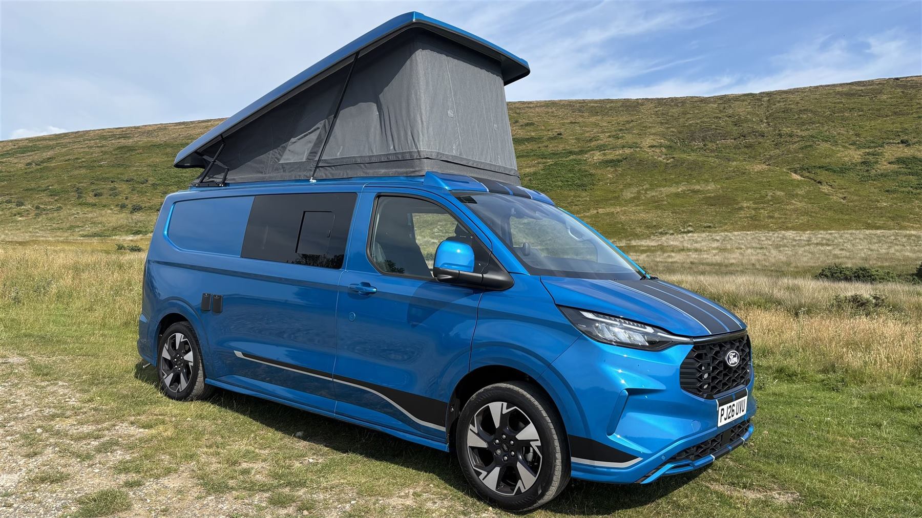 The van on the moors with the pop-top up in golden light